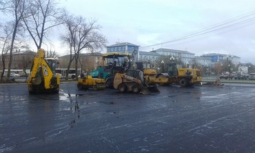 Работы по асфальтированию