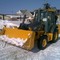 New Holland B110, John Deere325J