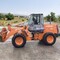 Caterpillar, Hitachi, АМКОДОР